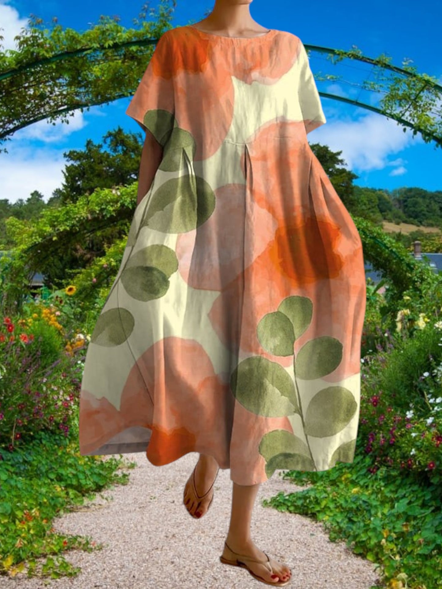 Embla | Lässiges Damenkleid mit botanischem Blumenmuster aus leichtem Stoff, kurze Ärmel, lockere Passform | Orange