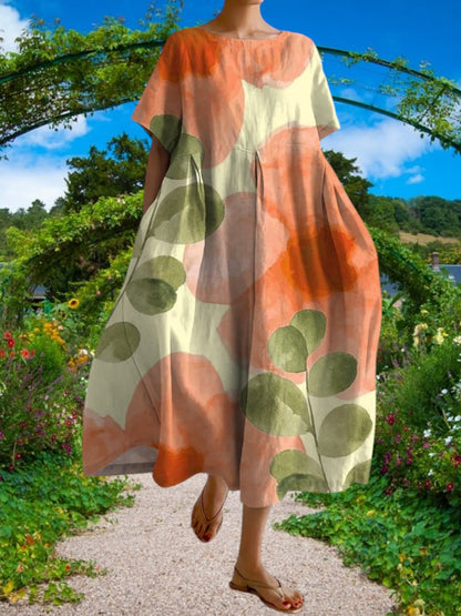 Embla | Lässiges Damenkleid mit botanischem Blumenmuster aus leichtem Stoff, kurze Ärmel, lockere Passform | Orange